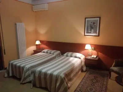 Letto o letti in una camera di Hotel Due Fontane