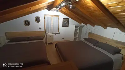 Letto o letti in una camera di Il BORGO DEL VENTASSO