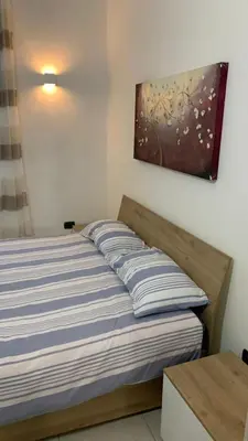 Letto o letti in una camera di A Casa di Fede&Ele all'interno delle mura romane