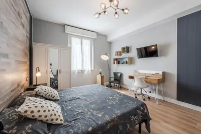 Letto o letti in una camera di La Casa di Parma - Strategic Location