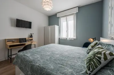 Letto o letti in una camera di La Casa di Parma - Strategic Location