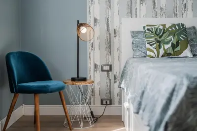 Letto o letti in una camera di La Casa di Parma - Strategic Location