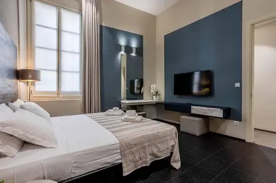 Letto o letti in una camera di Salina Luxury Suites