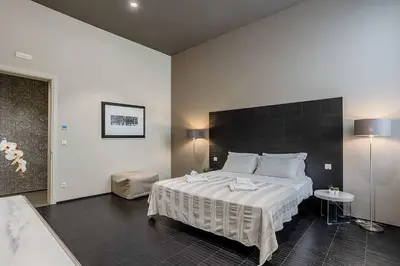 Letto o letti in una camera di Salina Luxury Suites