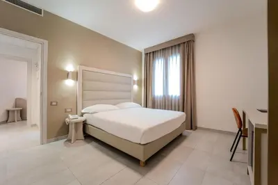Letto o letti in una camera di Hotel Donatello