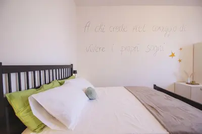 Letto o letti in una camera di Burro e salvia HOME Reggio Emilia apartment