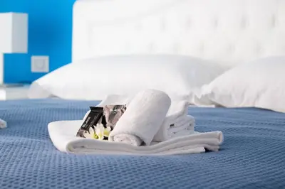 Letto o letti in una camera di Sirius Apartment - Affitti Brevi Italia