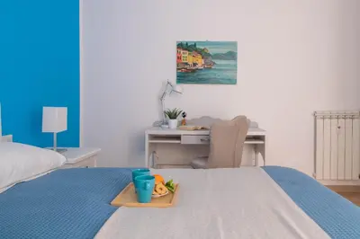 Letto o letti in una camera di Sirius Apartment - Affitti Brevi Italia