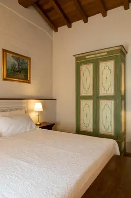 Letto o letti in una camera di Villa Simonetta