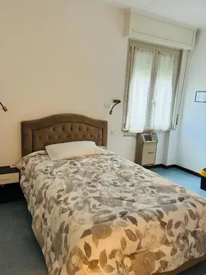 Letto o letti in una camera di Hotel Riccò
