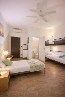 Letto o letti in una camera di Parma Station Rooms