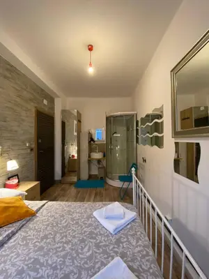 Letto o letti in una camera di Parma Station Rooms