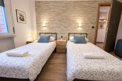 Letto o letti in una camera di Parma Station Rooms
