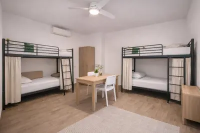 Letto o letti in una camera di Parma Station Rooms