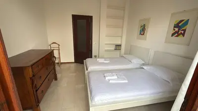 Letto o letti in una camera di Casa Angela