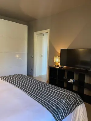 Letto o letti in una camera di Design & comfort Apartment in the very centre of Rubiera