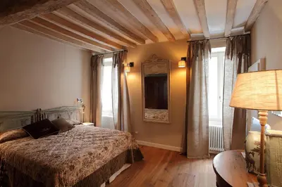 Letto o letti in una camera di PIO Rooms b&b Parma