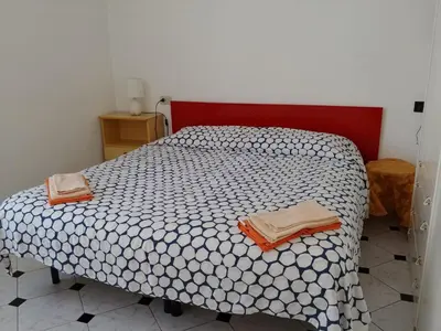 Letto o letti in una camera di Casa Auxilium