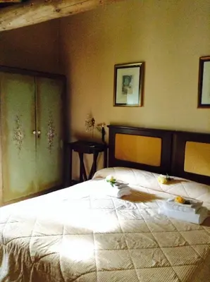 Letto o letti in una camera di Agriturismo Il Gelso