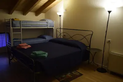 Letto o letti in una camera di Ostello Castello Mina Della Scala