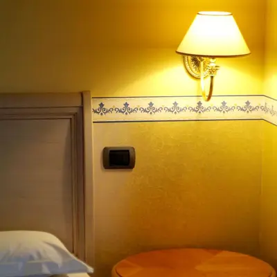 Letto o letti in una camera di Hotel Ristorante Novecento