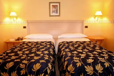 Letto o letti in una camera di Hotel Ristorante Novecento