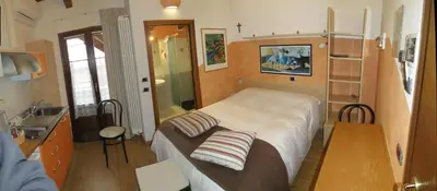 Letto o letti in una camera di La Baita D'Oro Ristorante Residence