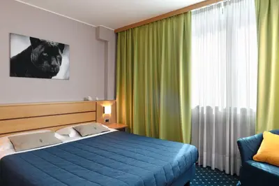 Letto o letti in una camera di Garda Hotel