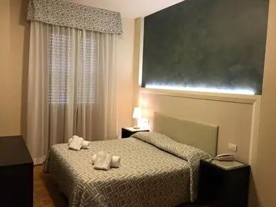 Letto o letti in una camera di Hotel Astoria