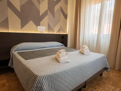 Letto o letti in una camera di Hotel Astoria