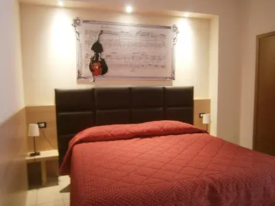Letto o letti in una camera di Albergo Visconti