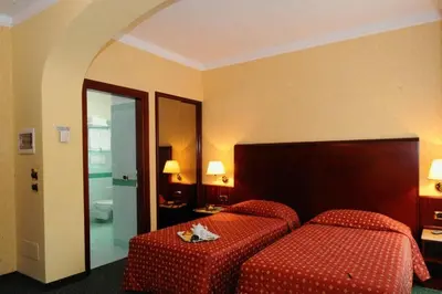 Letto o letti in una camera di Hotel La Spia D'Italia