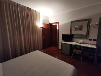 Letto o letti in una camera di Hotel Le Ville