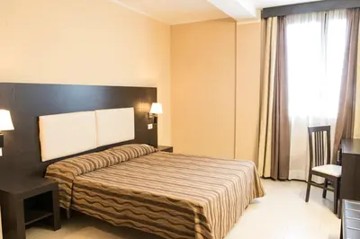 Letto o letti in una camera di Hotel Corte Business