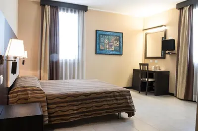 Letto o letti in una camera di Hotel Corte Business