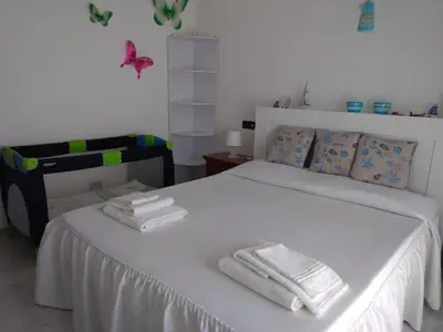 Letto o letti in una camera di Sarina House Ocean View