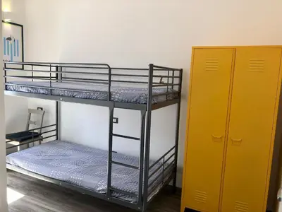 Letto o letti in una camera di Marco's House