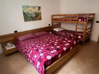 Letto o letti in una camera di Appartamento vicino al mare