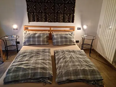 Letto o letti in una camera di B&B La Terrazza Sui Fieschi