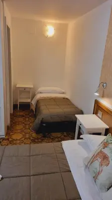 Letto o letti in una camera di Locanda Il Gigante