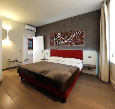 Letto o letti in una camera di B&B Opera
