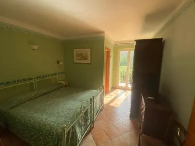 Letto o letti in una camera di Albergo Il Sicomoro