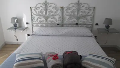 Letto o letti in una camera di B&B Agorà Sarzana