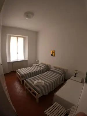 Letto o letti in una camera di A pochi passi dal mare by PortofinoVacanze