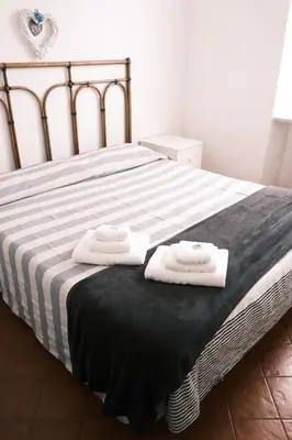 Letto o letti in una camera di A pochi passi dal mare by PortofinoVacanze