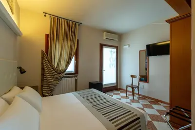 Letto o letti in una camera di A Casa Dei Gonzaga, MantegnaHotels