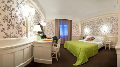 Letto o letti in una camera di Europa Hotel Design Spa 1877