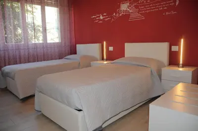 Letto o letti in una camera di Affittacamere La Perla