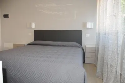 Letto o letti in una camera di Affittacamere La Perla