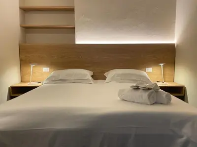 Letto o letti in una camera di Hotel Abetaia